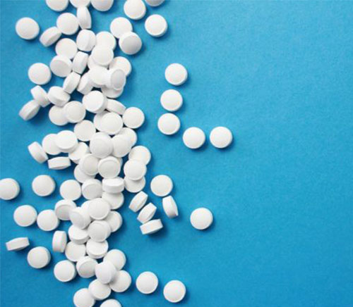Pills on blue background