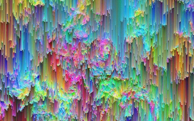 Abstract image of many bright colours dripping in a waterfall