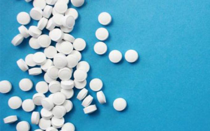 Pills on blue background