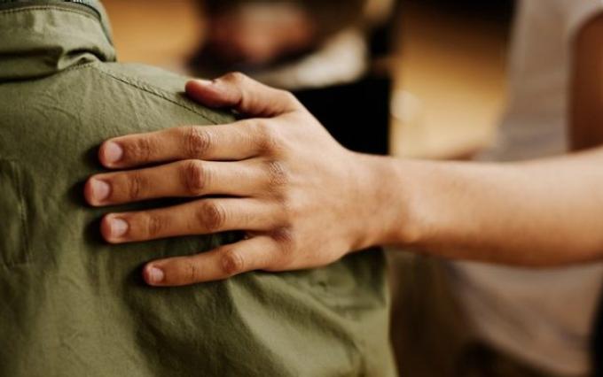 Hand on shoulder